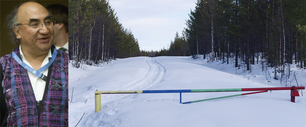 På vägen till den planerade gruvplatsen finns det en vägbom som någon målat med de samiska färgerna.